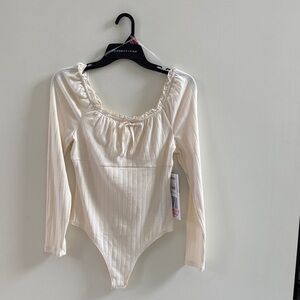 Celebrity Pink Ivory Ribbed Long-Sleeve Ruffle Scoop Bodysuit
